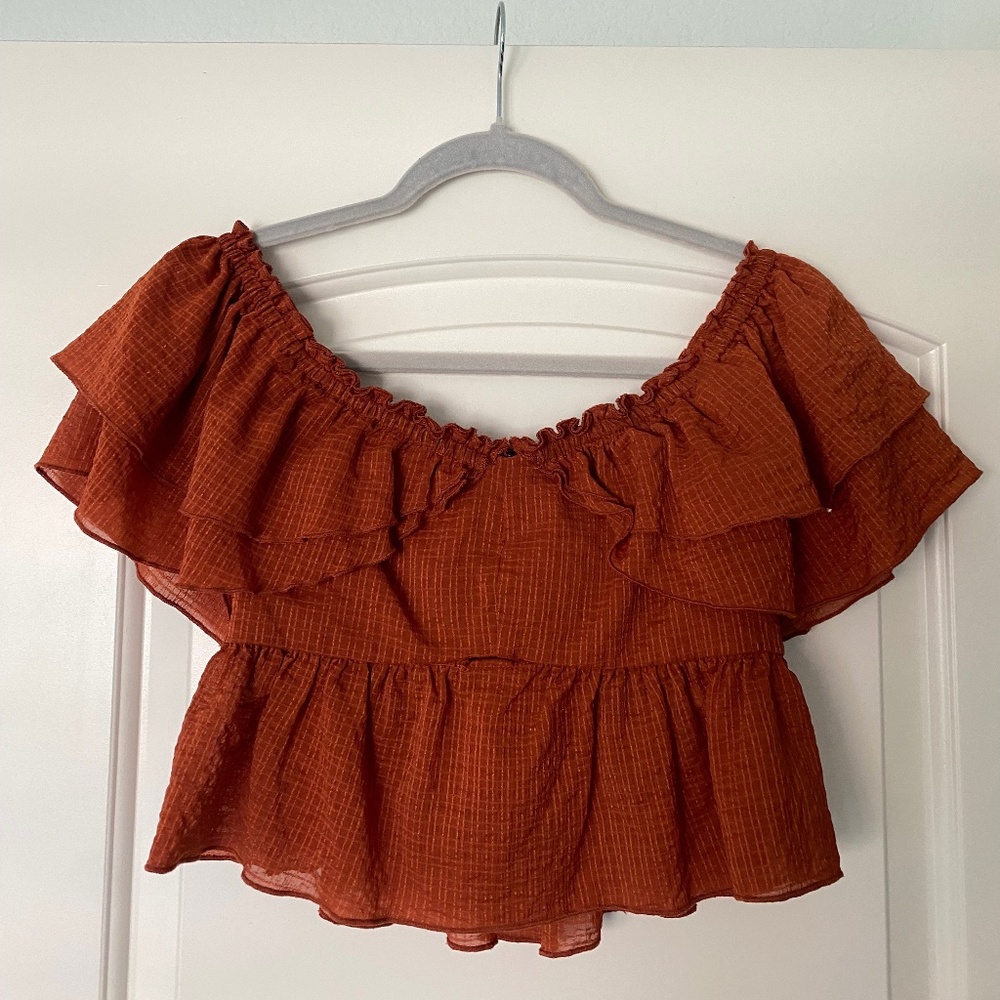 Off-the-shoulder pumpkin orange top